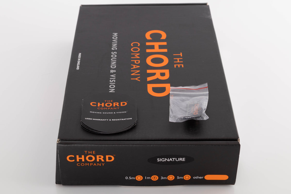 Box for a used Chord Company Signature RCA-RCA 1.0m Interconnect Cable showing Badge and Warranty and Registration