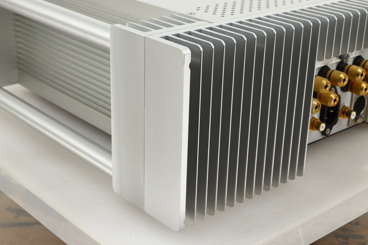 Rear left corner view of a used Chord Electronics SPM1200C Power Amplifier in Silver finish