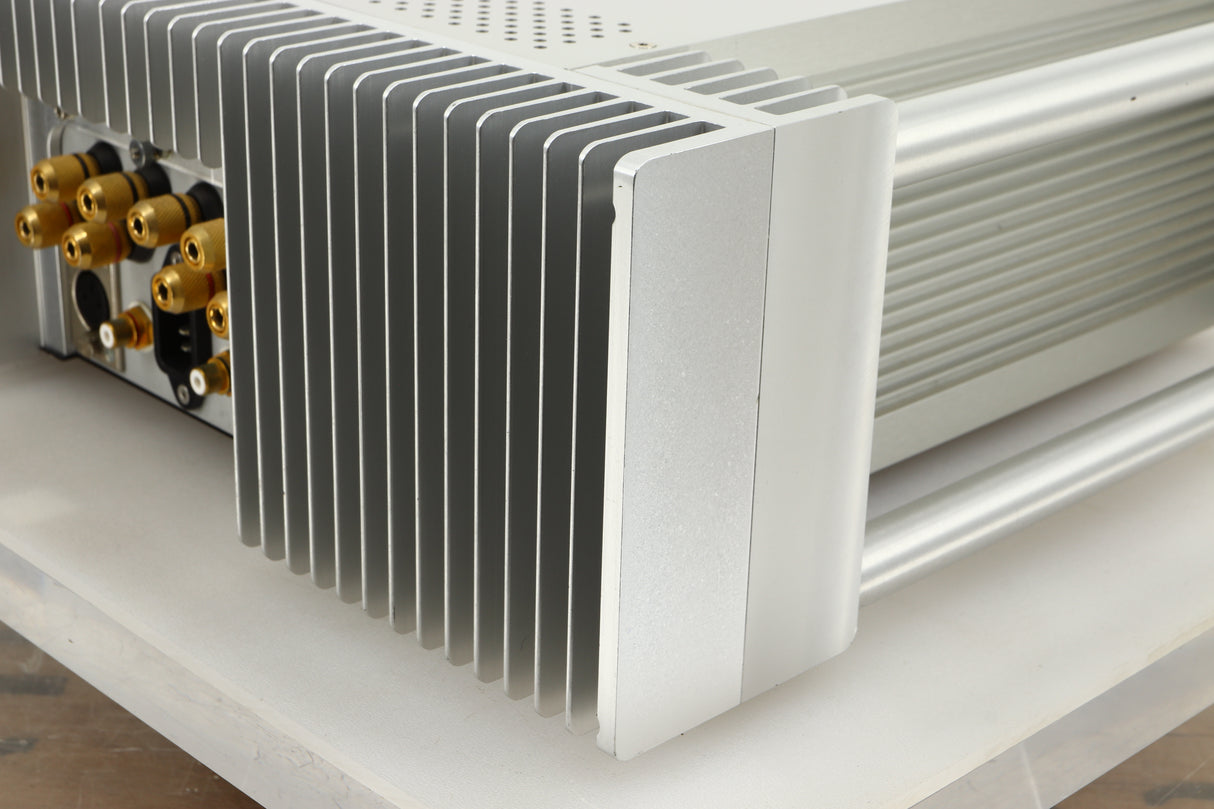 Rear right corner view of a used Chord Electronics SPM1200C Power Amplifier in Silver finish