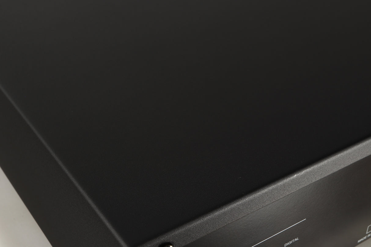 Close up of a used Copland CDA823 CD Player in a silver finish showing scratches on top