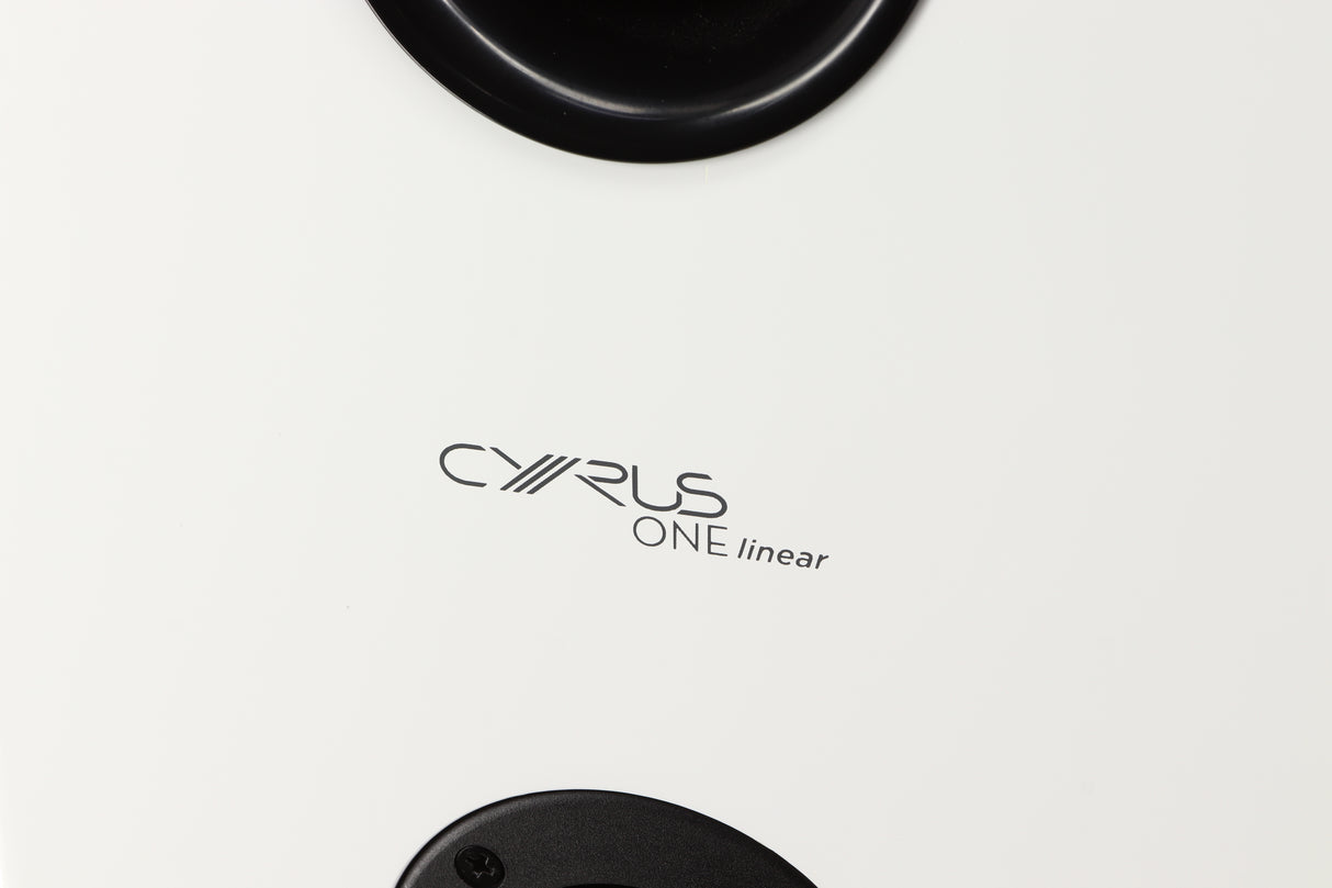 Close up of a used Cyrus ONE Linear Standmount Speaker in a gloss white finish showing logo