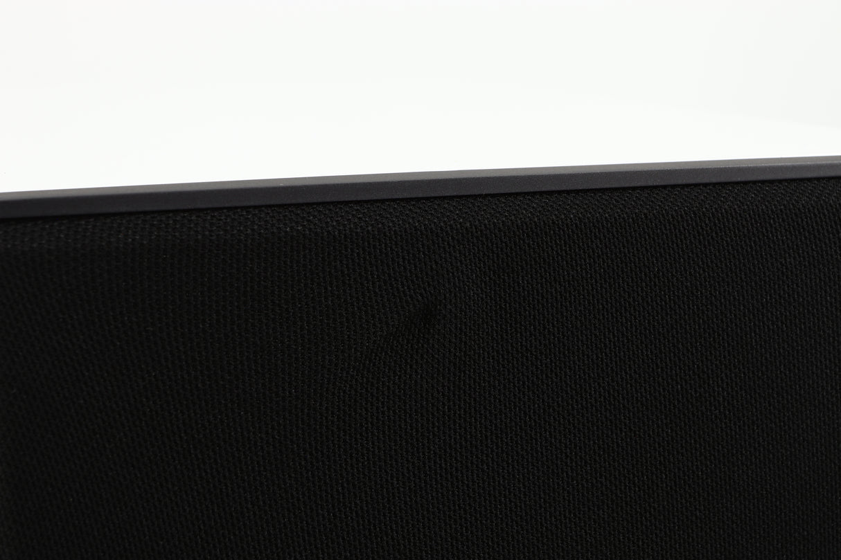 Close up of a used Cyrus ONE Linear Standmount Speaker in a gloss white finish showing small crease in the grille