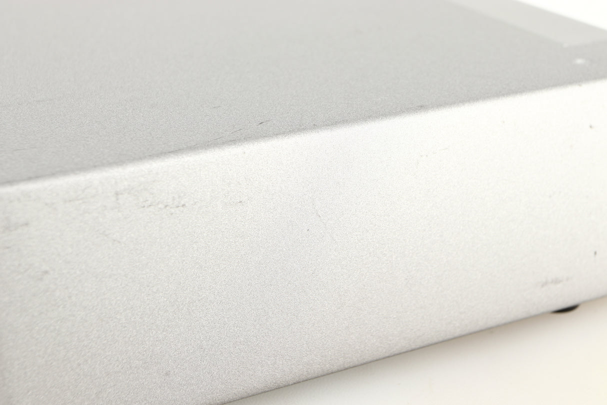 Close up of a used Cyrus Q-Power Power Amplifier in a silver finish showing scratching on unit