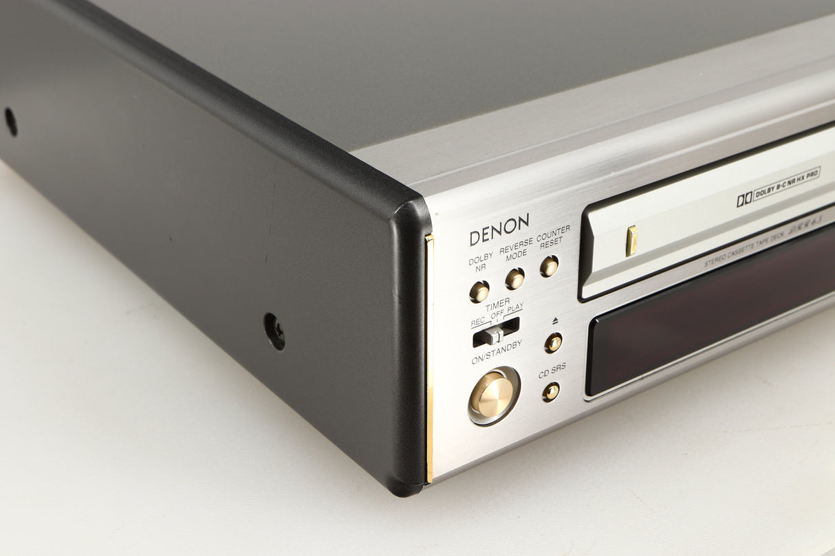 Front left corner of a used Denon DDR-6.5 Cassette Deck in a silver finish