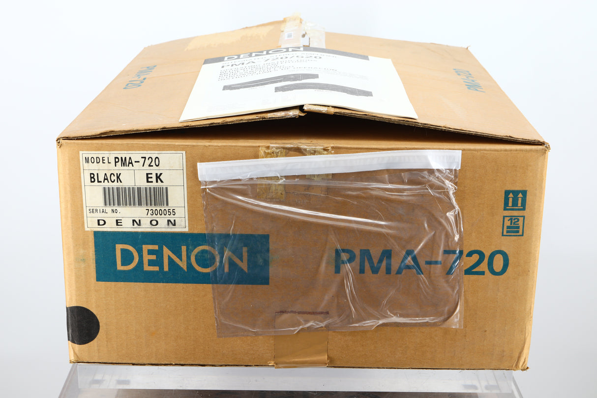Box of a used Denon PMA-720 Integrated Amplifier in Black finish showing manual