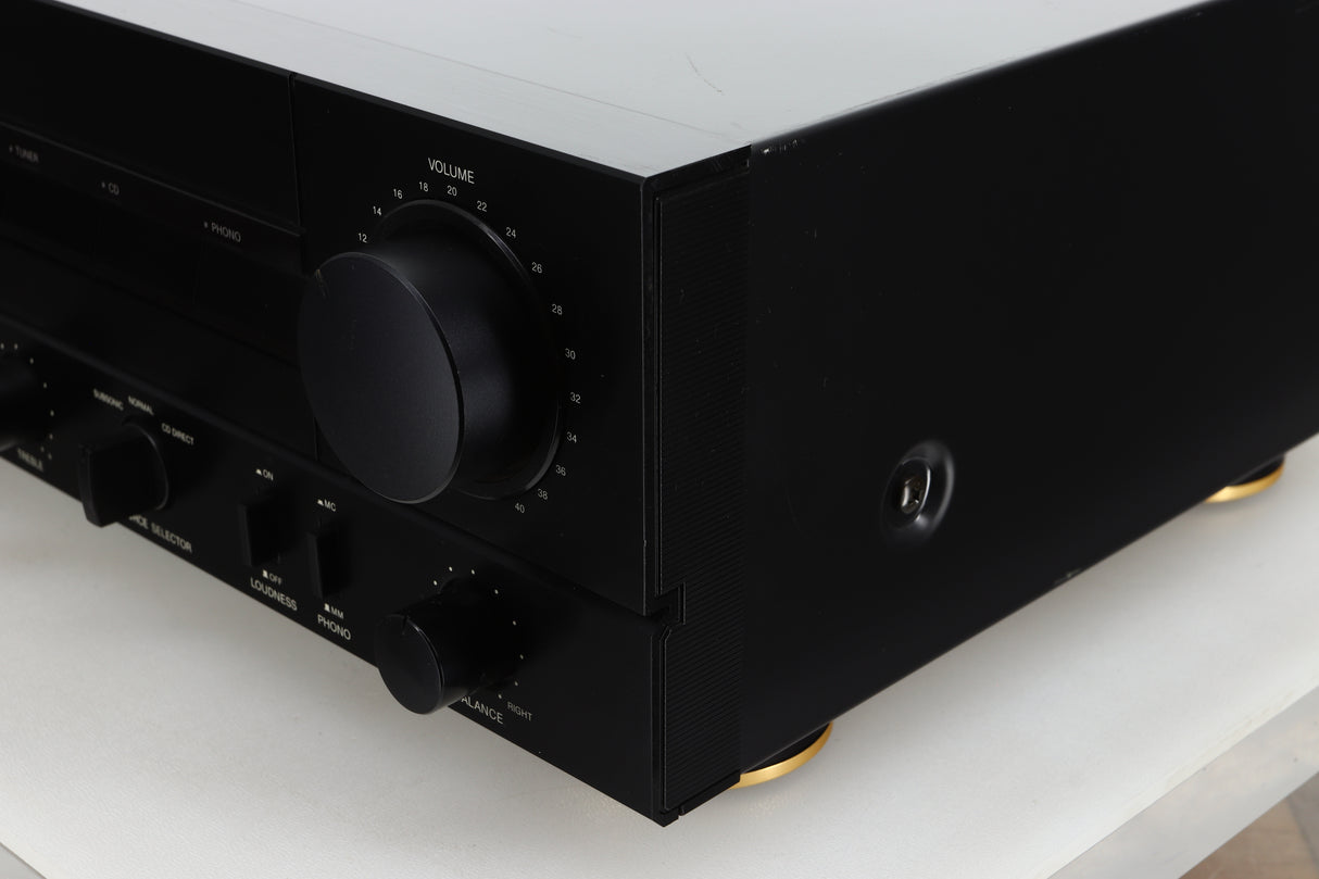 Front right corner view of a used Denon PMA-720 Integrated Amplifier in Black finish