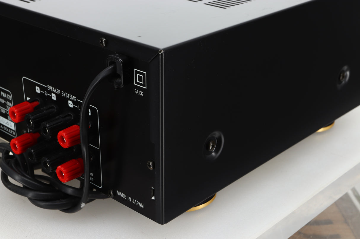 Rear right corner view of a used Denon PMA-720 Integrated Amplifier in Black finish