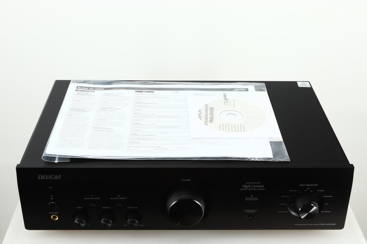 Top view of a used Denon PMA600 Integrated Amplifier in a black finish showing manual