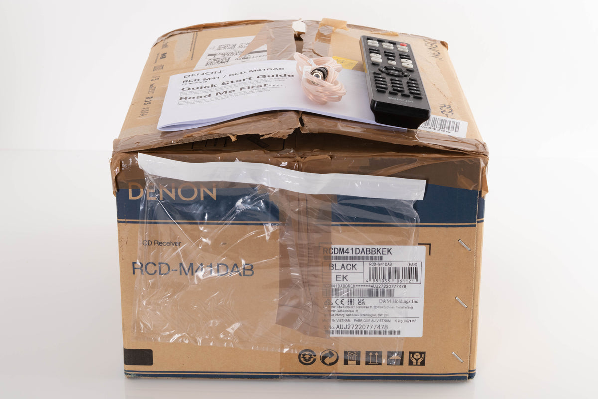Box of a used Denon RCD M41DAB Music System in Black with aerial, remote, and manual