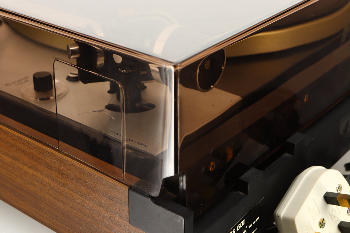 Close up of a used Dual 601 Turntable / Goldring 1042 Cartridge in a walnut finish showing crack on lid