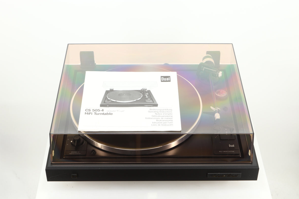 Top view of a used Dual CS 505-4 Turntable in a black finish showing the manual