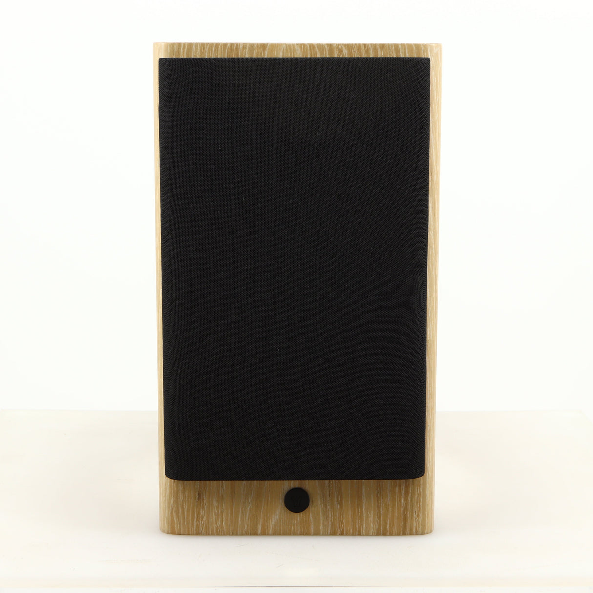 Front view of a used Dynaudio Focus 10 Standmount Speaker in a blonde finish showing Grille