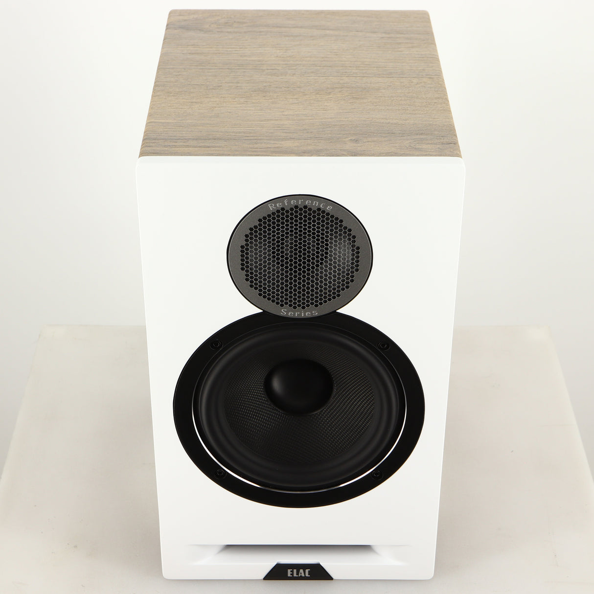 Top of a used ELAC DBR62 Standmount Speaker in a light oak finish