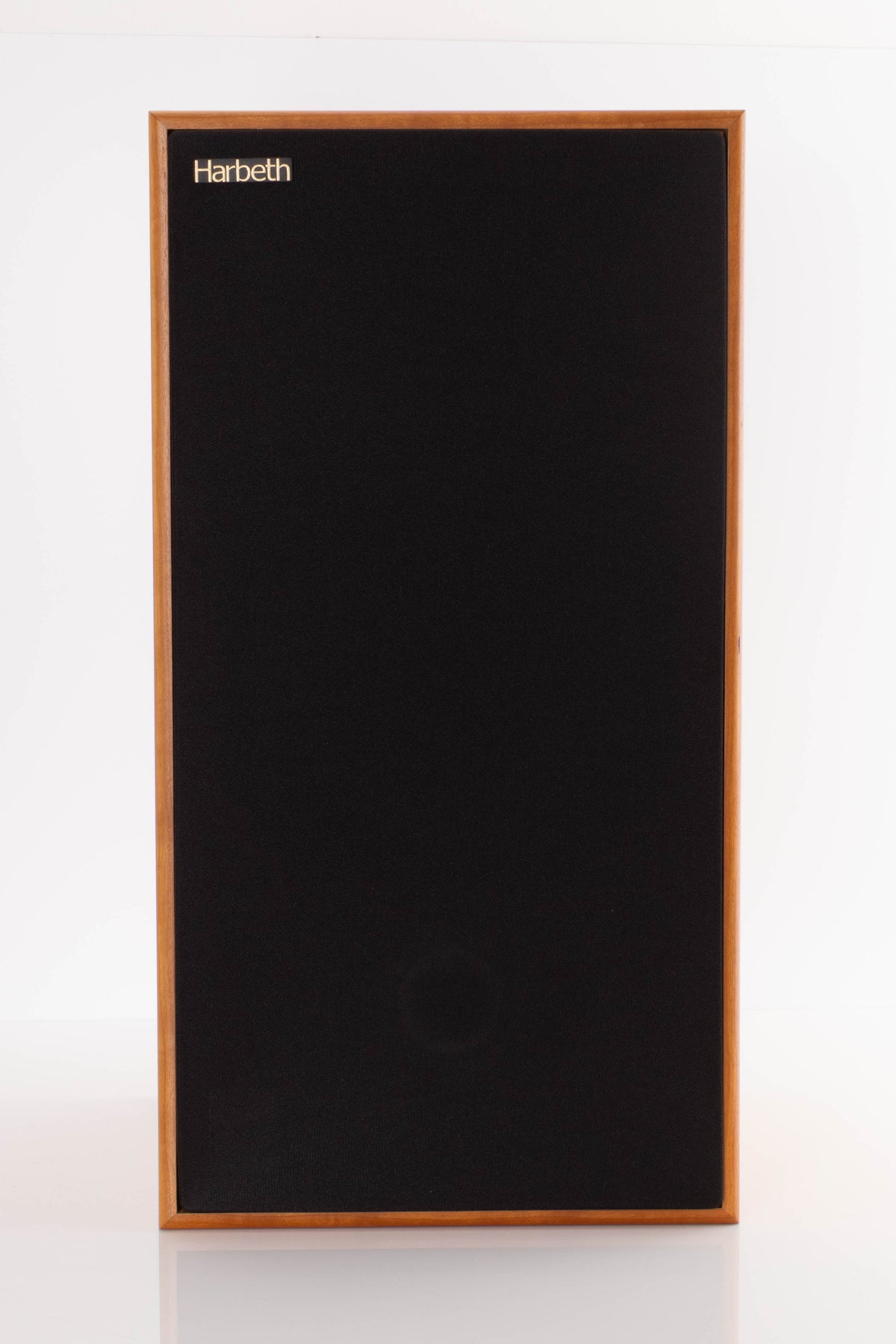 Front view of a used Harbeth Compact 7ES 3 Standmount Speaker in a Cherry finish showing Grille
