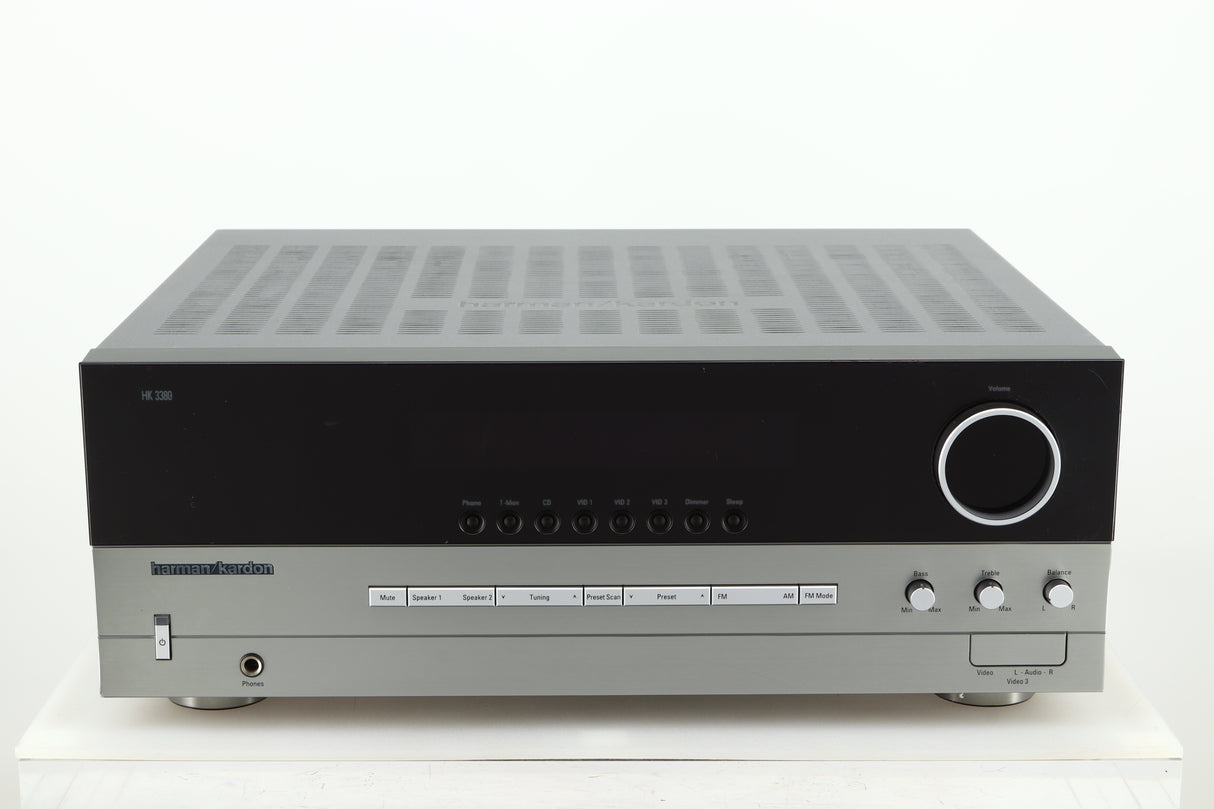 Front view of a used Harman Kardon 3380 Receiver in a silver finish
