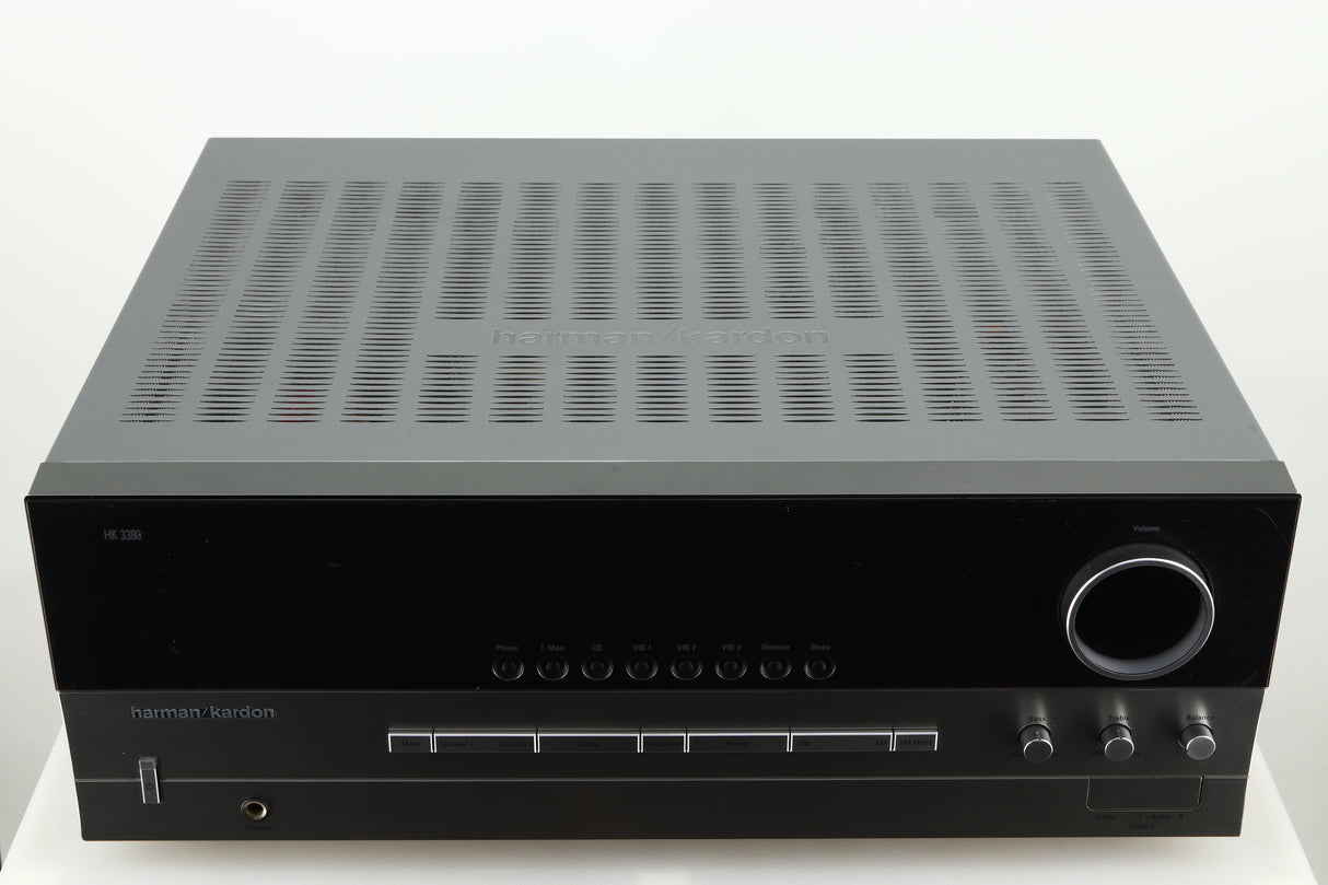 Top of a used Harman Kardon 3380 Receiver in a silver finish
