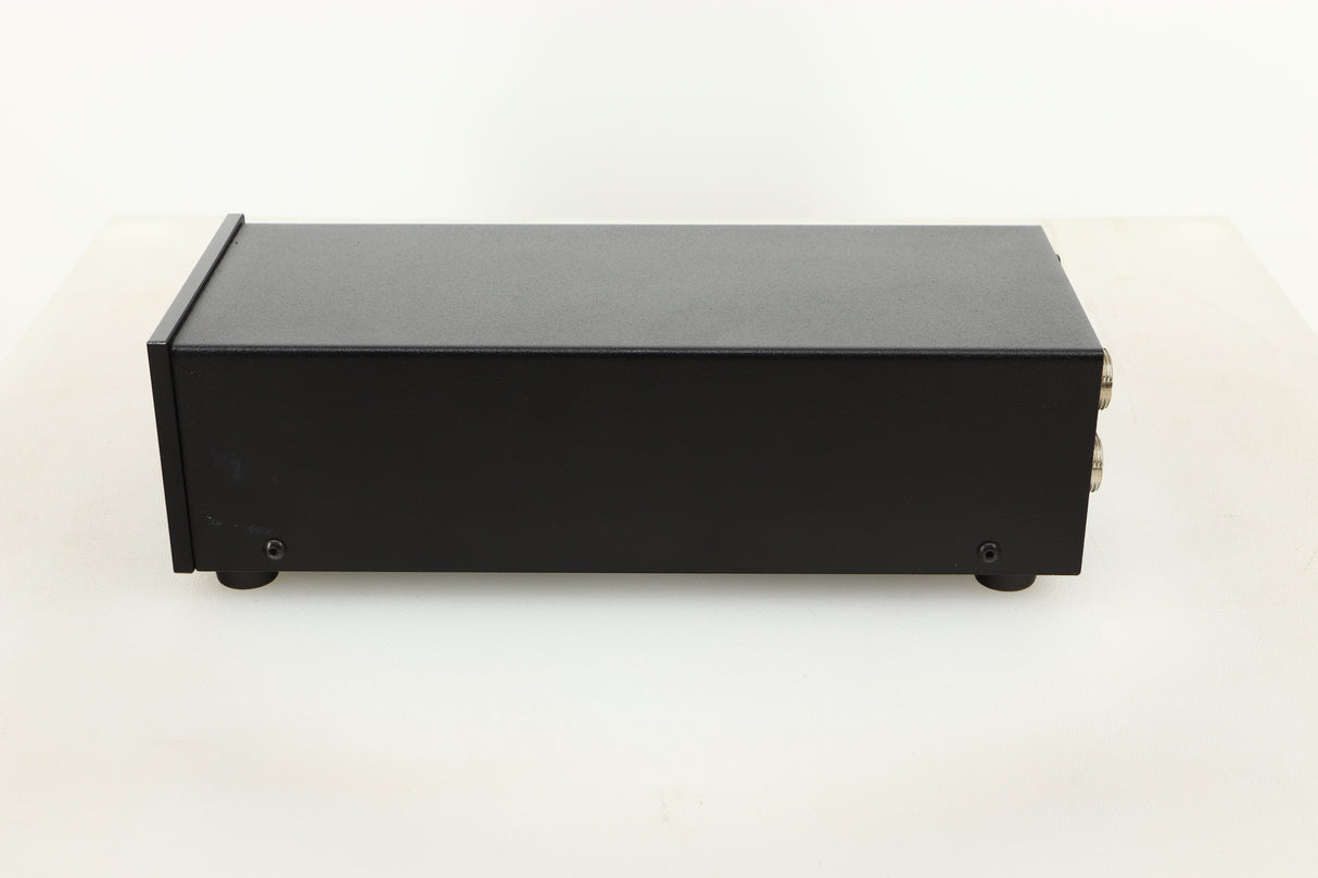 Side view of a used Heed Q-PSU III Power Supply