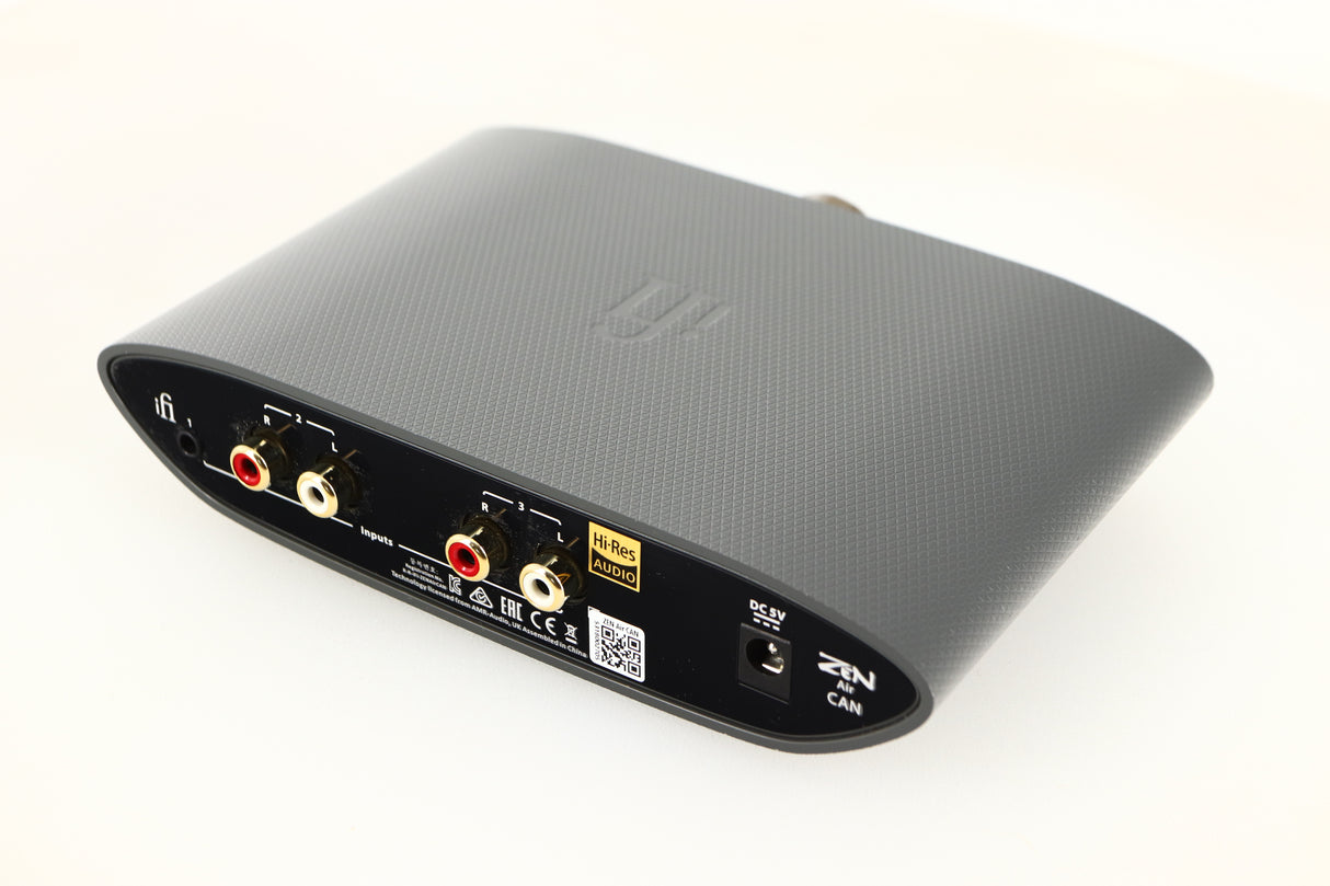 Close up of a used iFi Audio Zen Air Can Headphone Amplifier showing some marks and scratches on rear