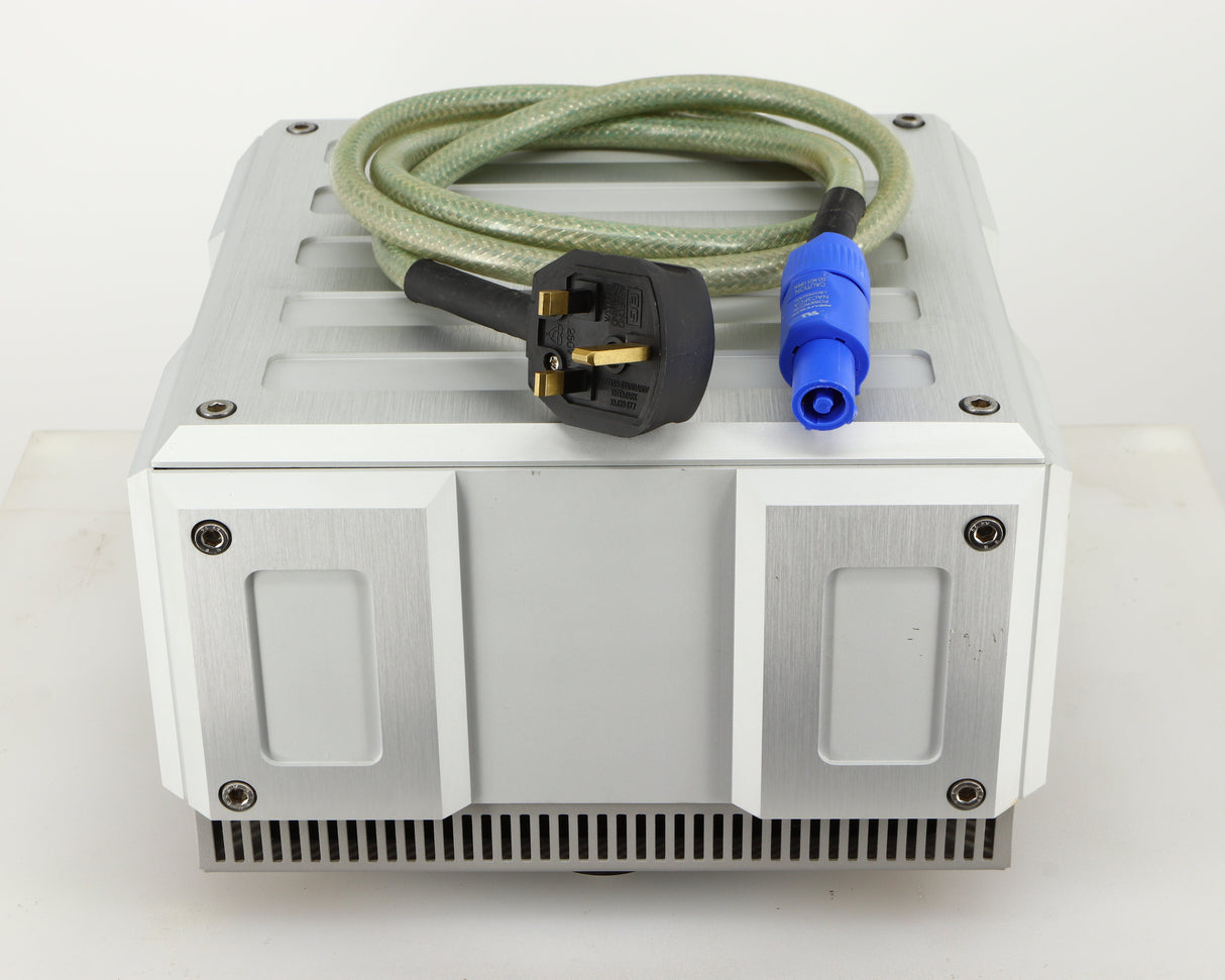 Top of a used Isotek Titan Mains Conditioner in a silver finish showing Mains Cable