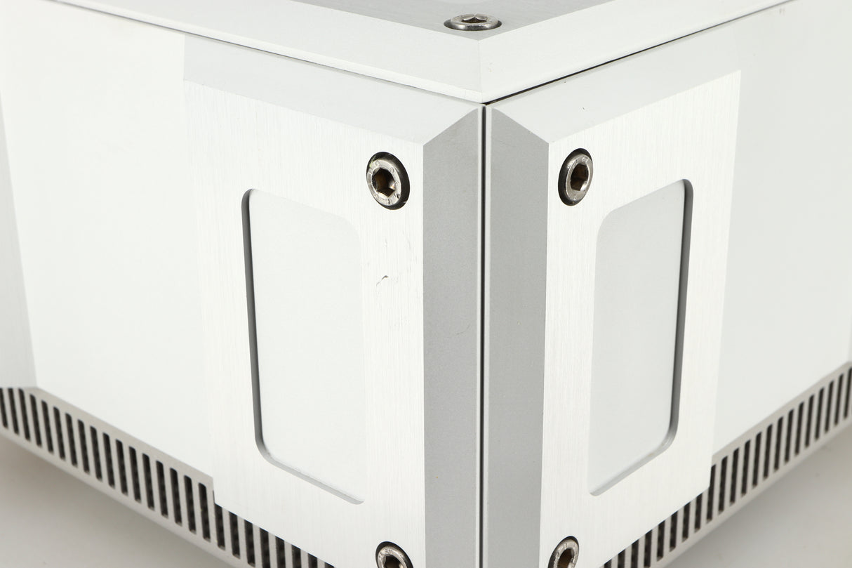 Close up of a used Isotek Titan Mains Conditioner in a silver finish showing some scratching