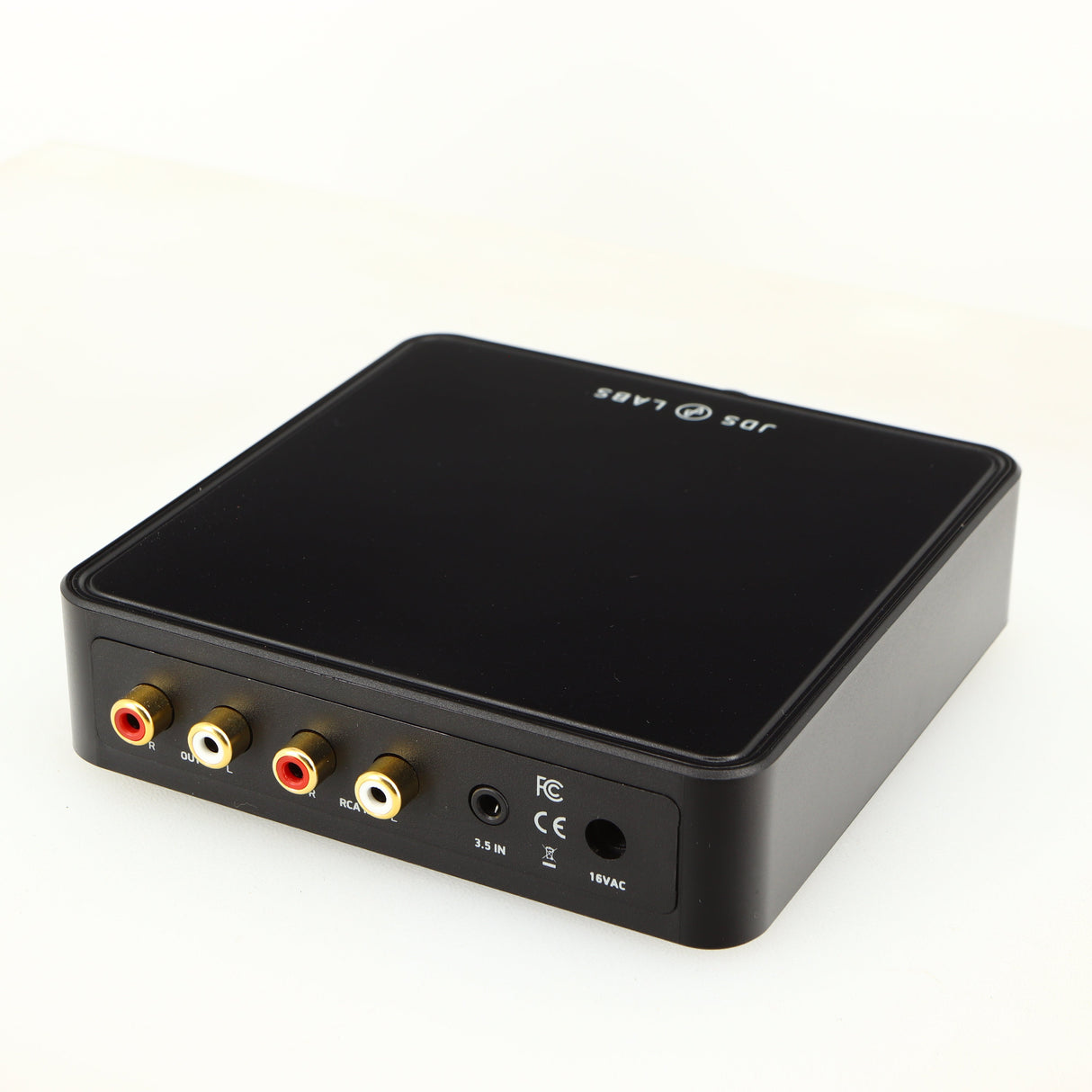 Close up of a used JDS Labs Atom Headphone Amplifier in a black finish showing rear