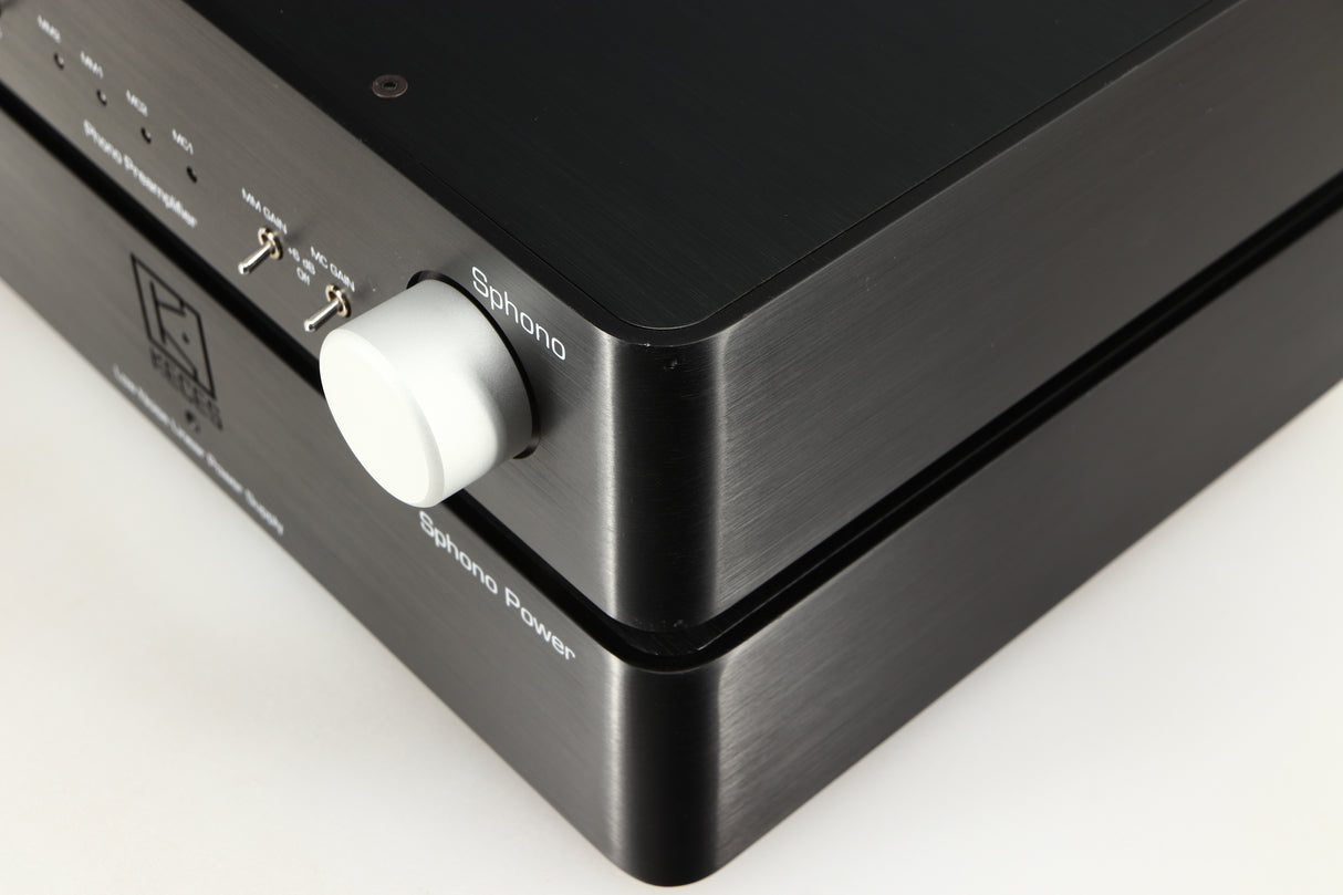 Close up of a used Keces Sphono Phonostage in a black finish showing small chip on front right corner