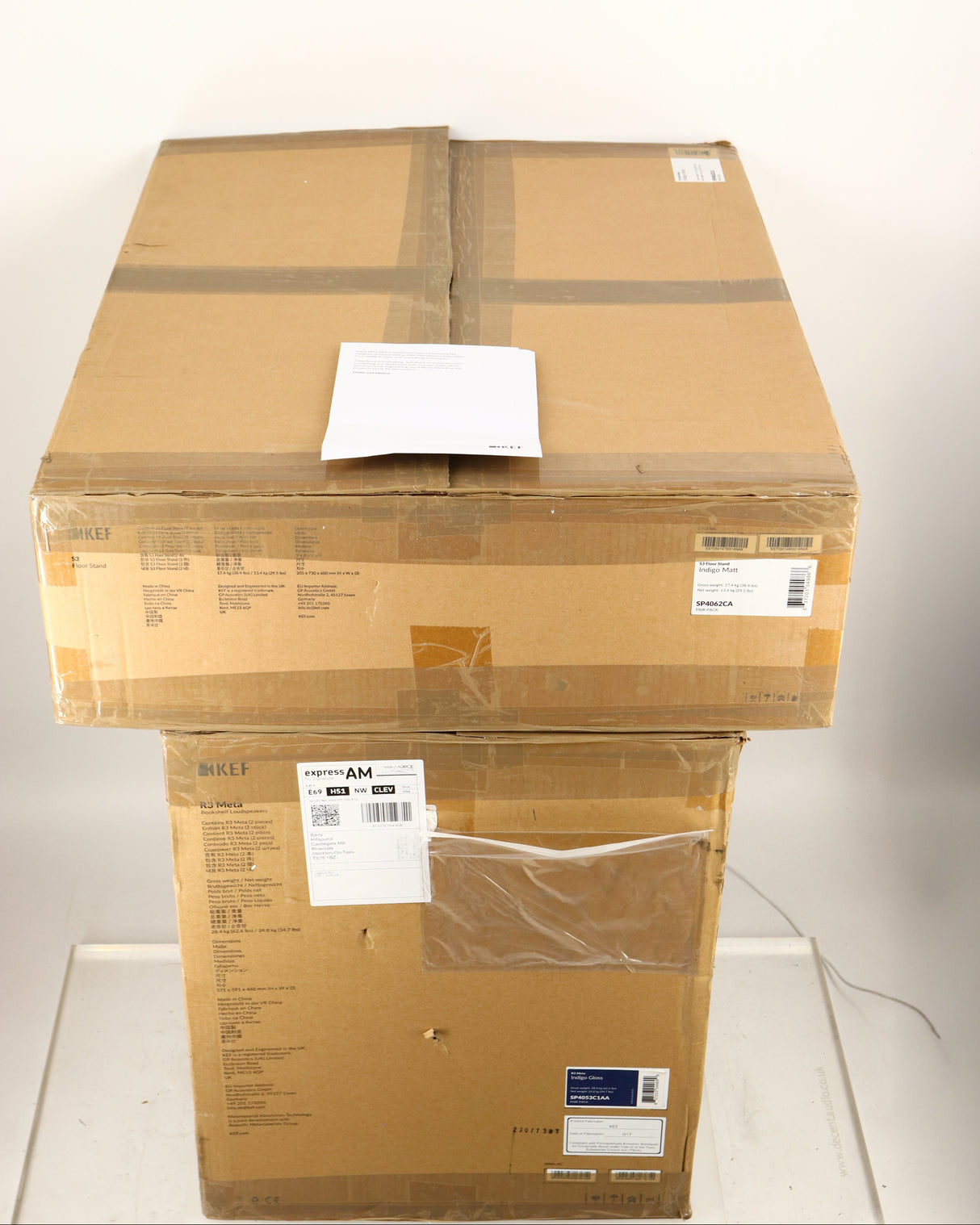 Boxes for used KEF R3 META Standmount Speakers W/ Stands in an indigo gloss finish showing Manual