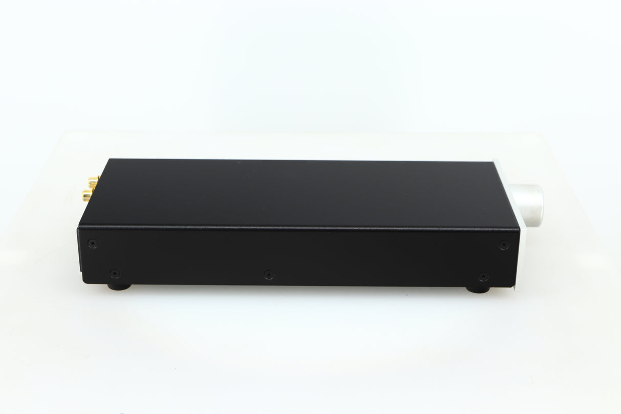 Left side view of a used Lehmann Black Cube Linear Headphone Amplifier in a silver finish