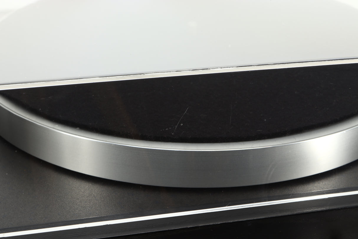 Close up of a used Linn Basik Turntable / Akito Tonearm in a black finish showing a scratch on the rear of the lid