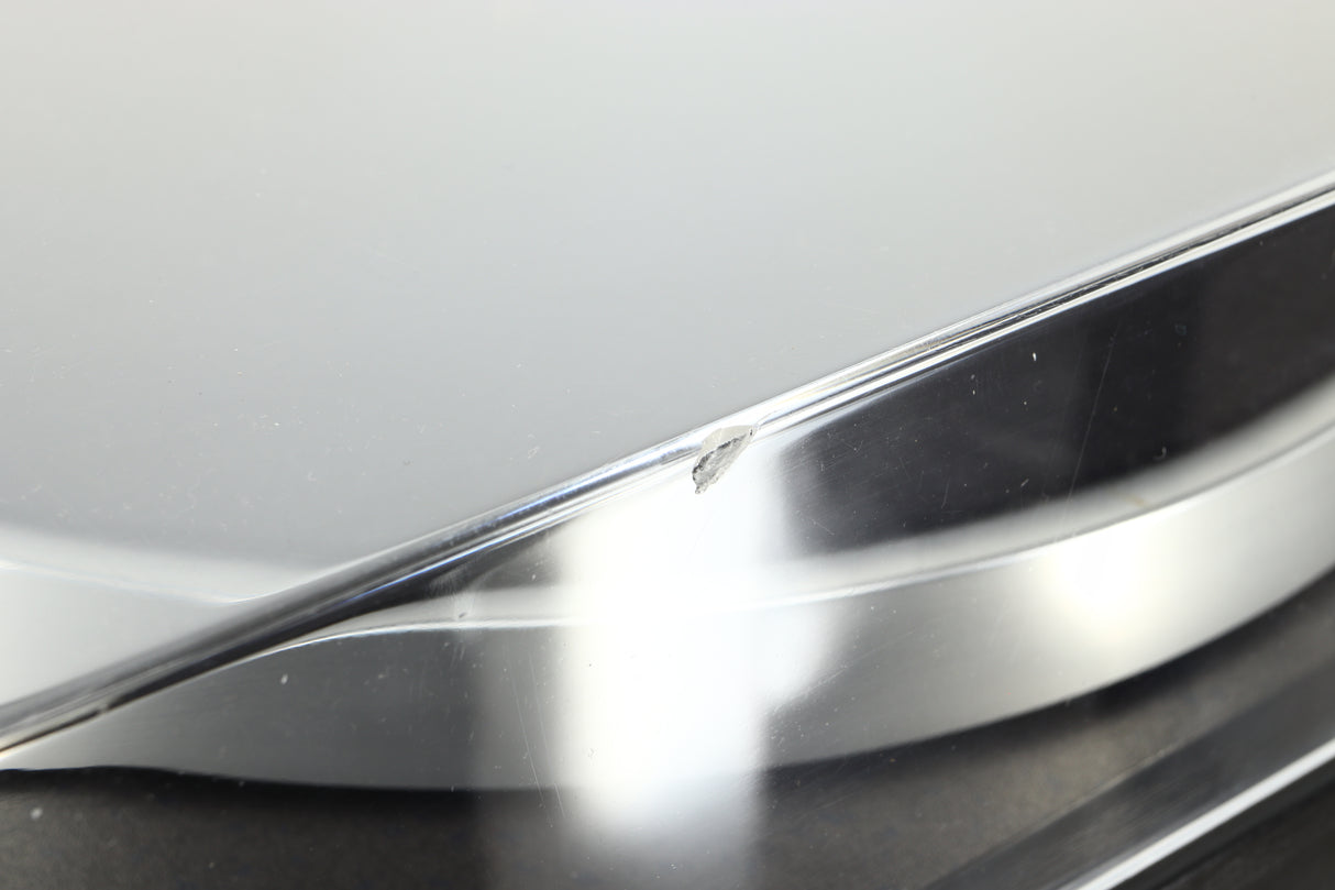 Close up of a used Linn Basik Turntable / Akito Tonearm in a black finish showing a chip on the front edge lid