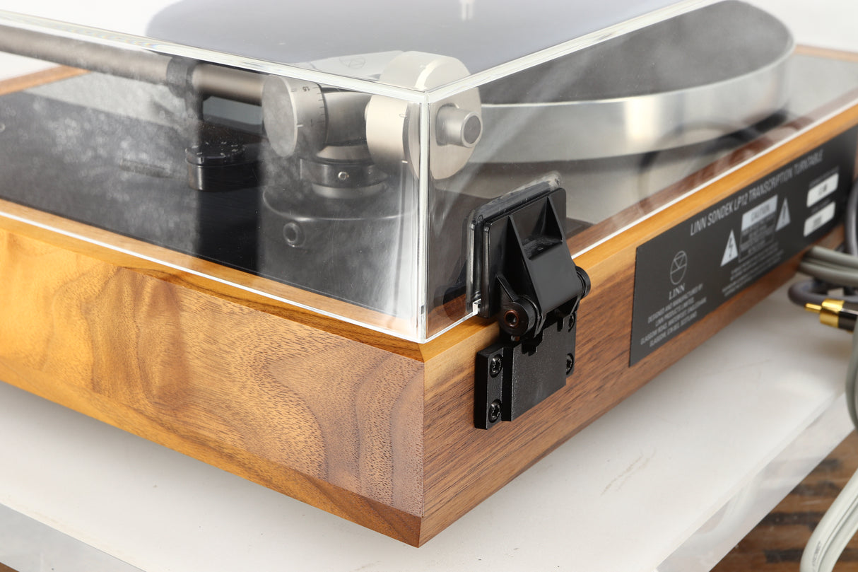 Rear right corner of a used Linn LP12 Akurate Turntable / Ekos SE Tonearm / Krystal Cartridge in a walnut finish