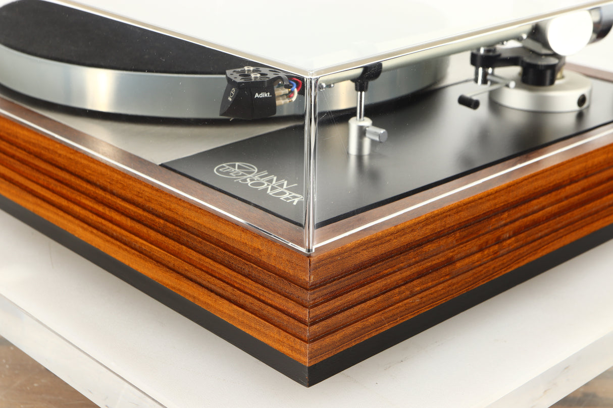 Front right corner of a used Linn LP12 / Ittok Tonearm / Adikt Cartridge in an afromosia finish