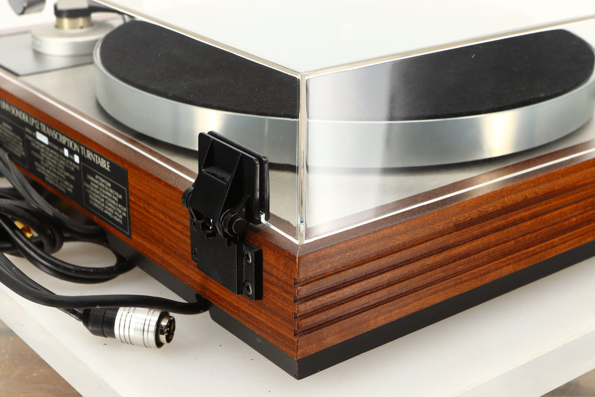 Rear left corner of a used Linn LP12 / Ittok Tonearm / Adikt Cartridge in an afromosia finish