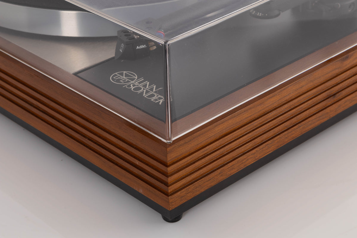 Front right corner view of a used Linn LP12 Turntable in Afromosia with Akito Tonearm and Adikt Cartridge