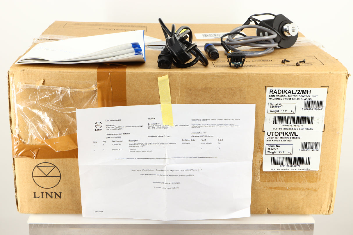 Box for a used Linn Radikal 2 Utopic Turntable Power Supply in a silver finish showing Manual, Mains Cable, Switch, 4x Screws and Motor