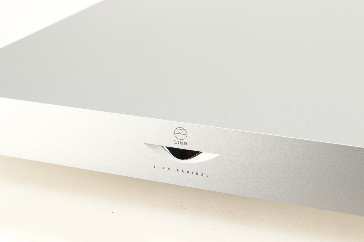 Close up of a used Linn Radikal 2 Utopic Turntable Power Supply in a silver finish showing some of the fascia