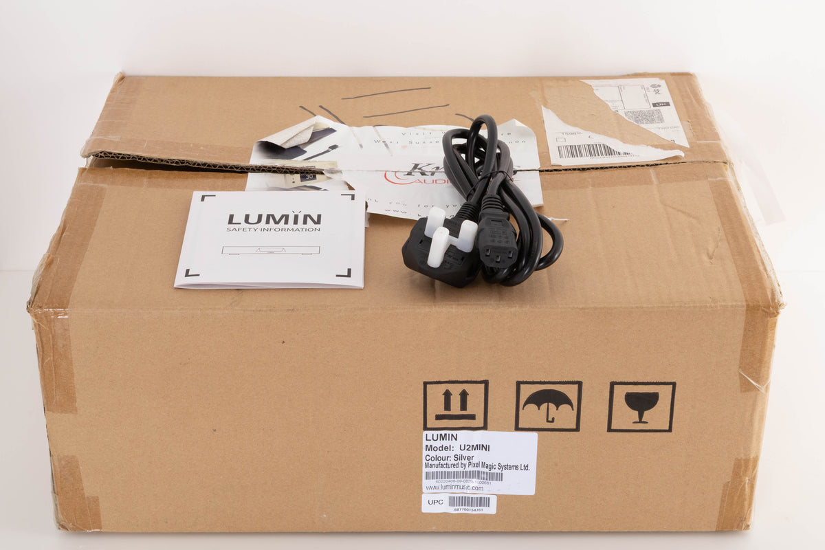 Box for a used Lumin U2 Mini Network Streamer in a Silver finish showing Safety Information Booklet and Mains Cable