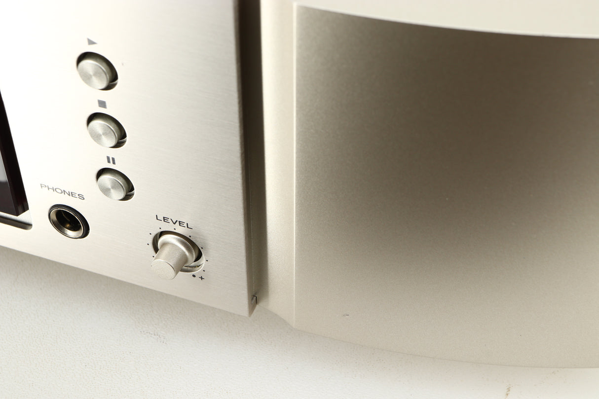 Close up of a used Marantz CD6006 UK Edition CD Player in a silver finish showing small nick on fascia