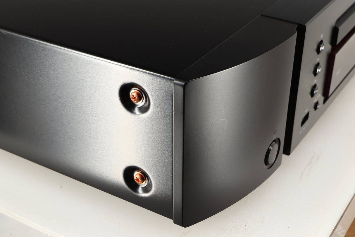 Front left corner of a used Marantz CD6007 CD Player in a black finish