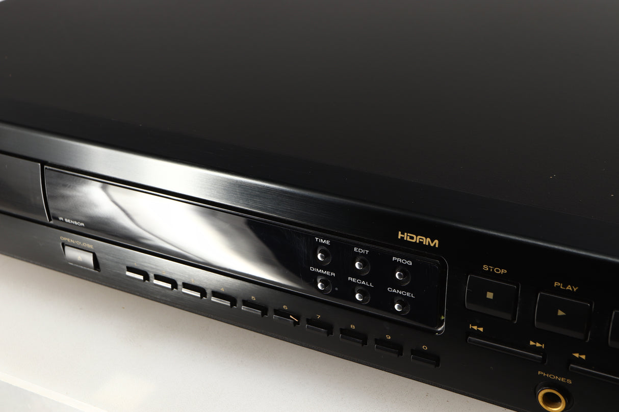 Close up of a used Marantz CD63 KI Signature CD Player in a black finish showing scratching on screen