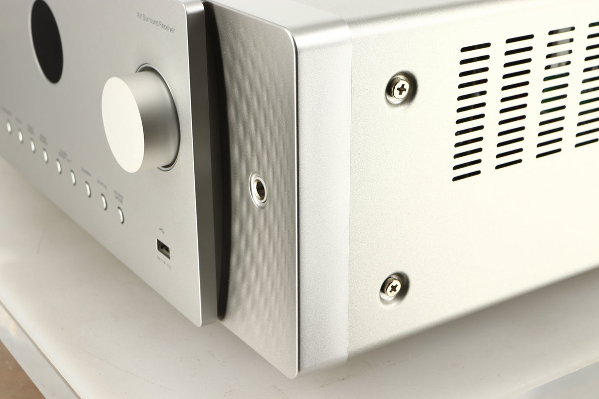 Front right corner of a used Marantz Cinema 60 AV Receiver in a silver finish
