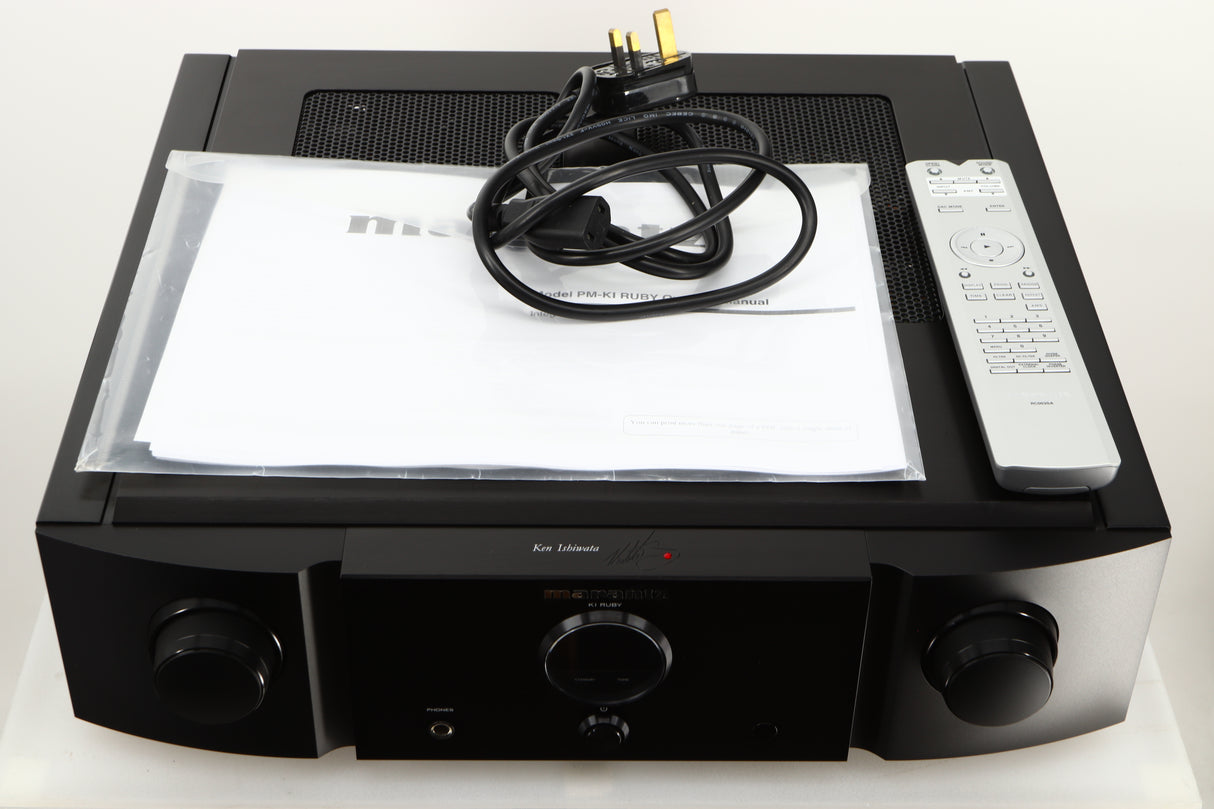 Top of a used Marantz KI Ruby Integrated Amplifier in a black finish showing Manual, Mains Cable and Remote