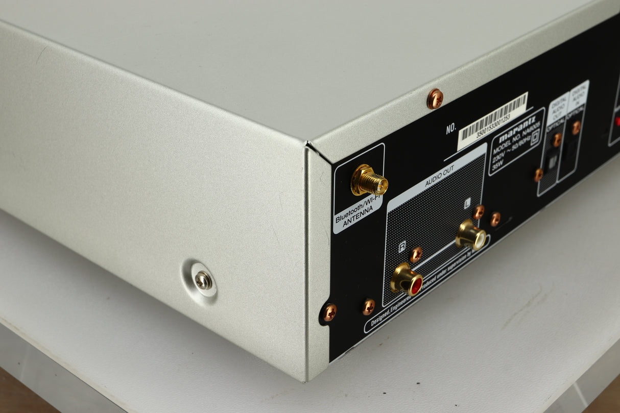 Close up view the back left of a used Marantz NA6005 Network Player in silver finish