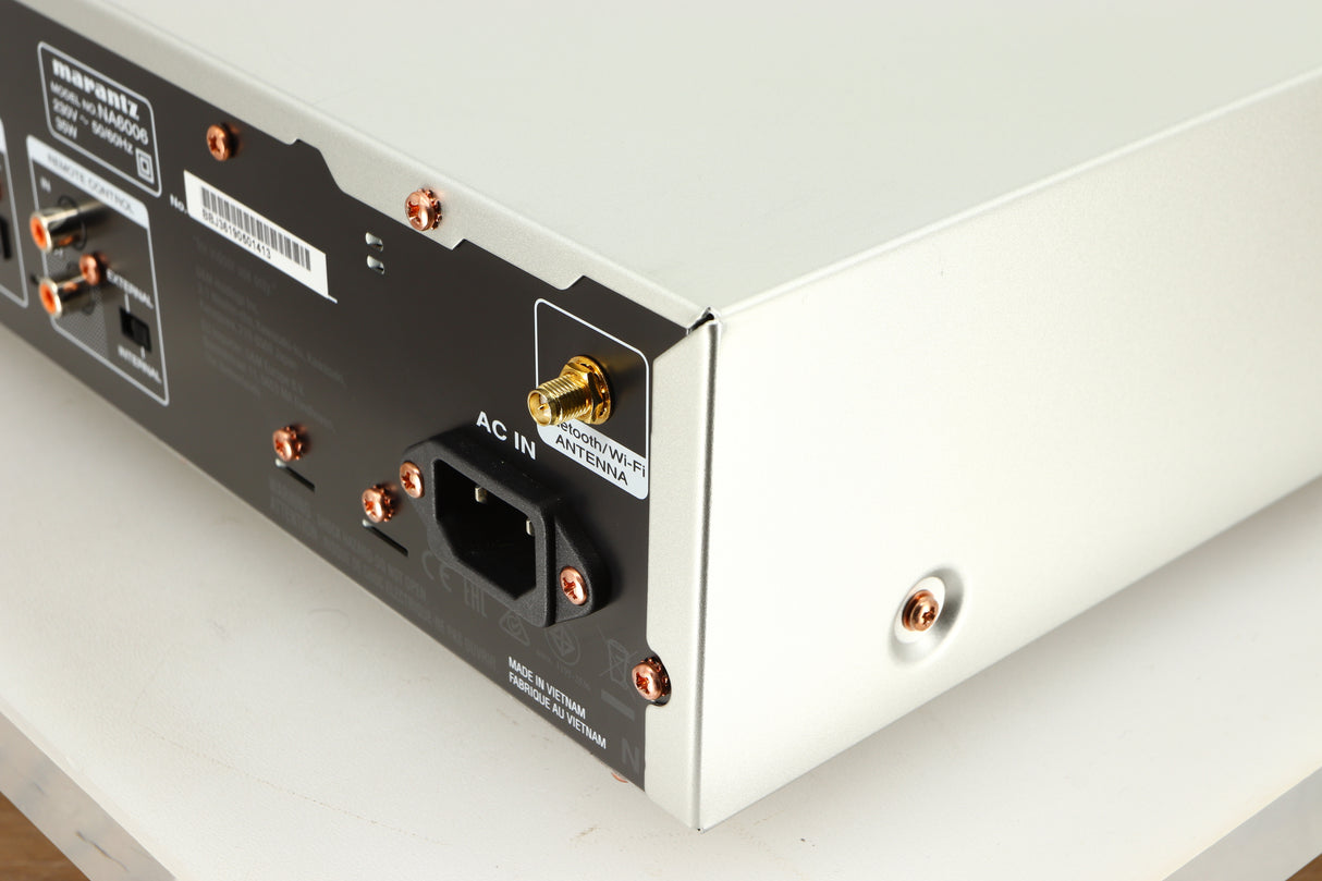 Rear left corner of a used Marantz NA6006 Network Player in a silver finish