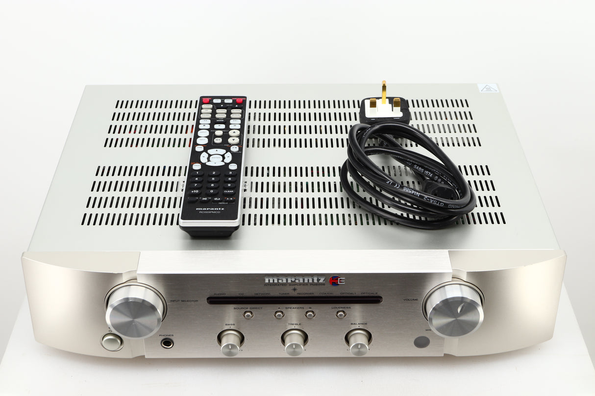 Box of a used Marantz PM6006 UK Edition Integrated Amplifier in Silver finish showing remote, and mains cable