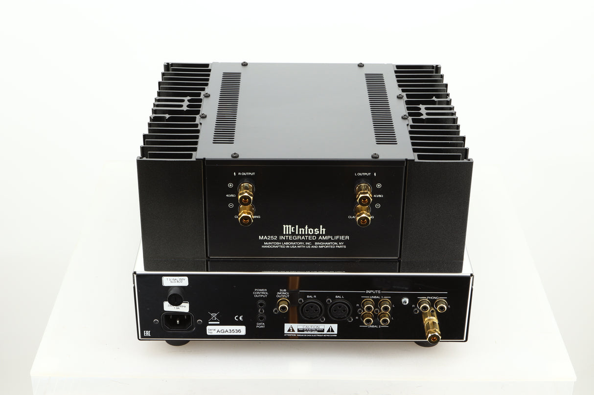 Rear view of a used McIntosh MA252 Integrated Amplifier showing Speaker outputs, XLR, mains, RCA, and phono inputs