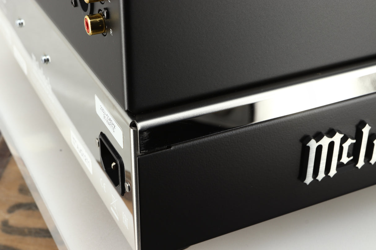 Close up of a used McIntosh MCD85 CD / SACD Player in a silver / black finish showing some light scratching