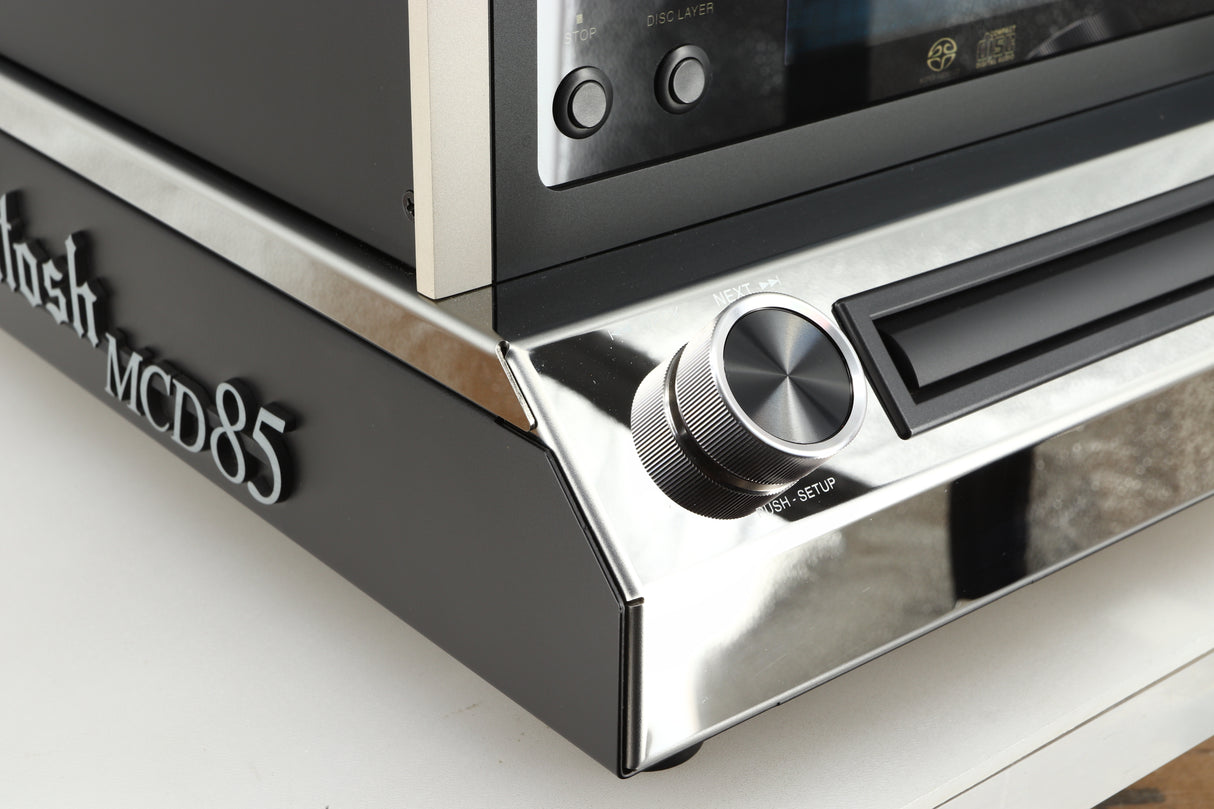 Front left corner of a used McIntosh MCD85 CD / SACD Player in a silver / black finish