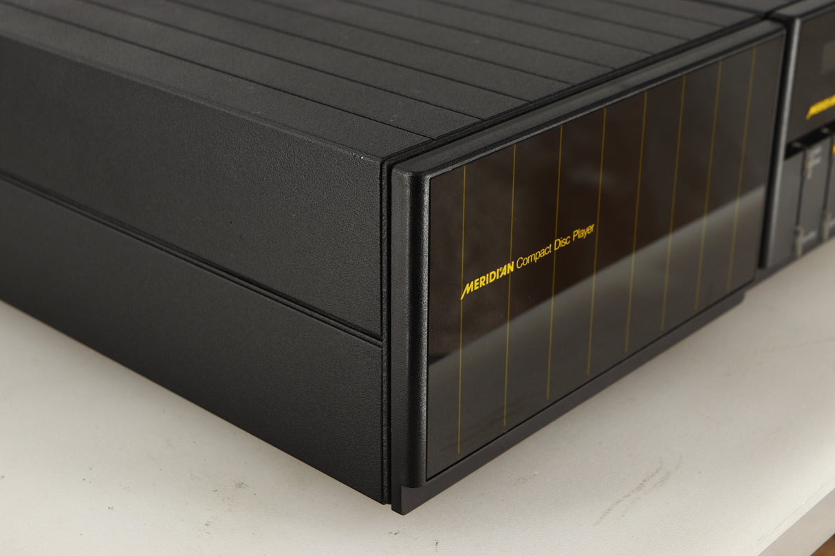 Front left corner of a used Meridian 200 CD Transport in a black finish