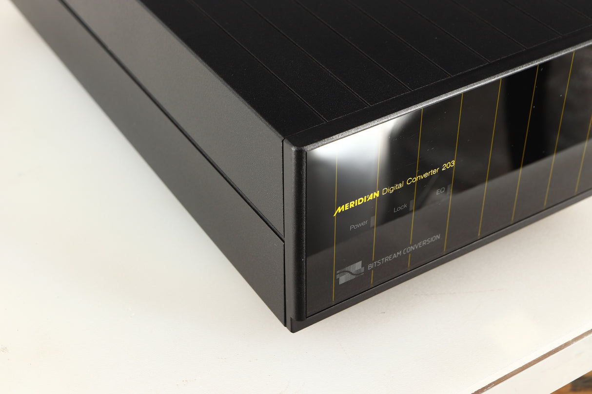 Front left corner of a used Meridian 203 Digital Analogue Converter in a black finish